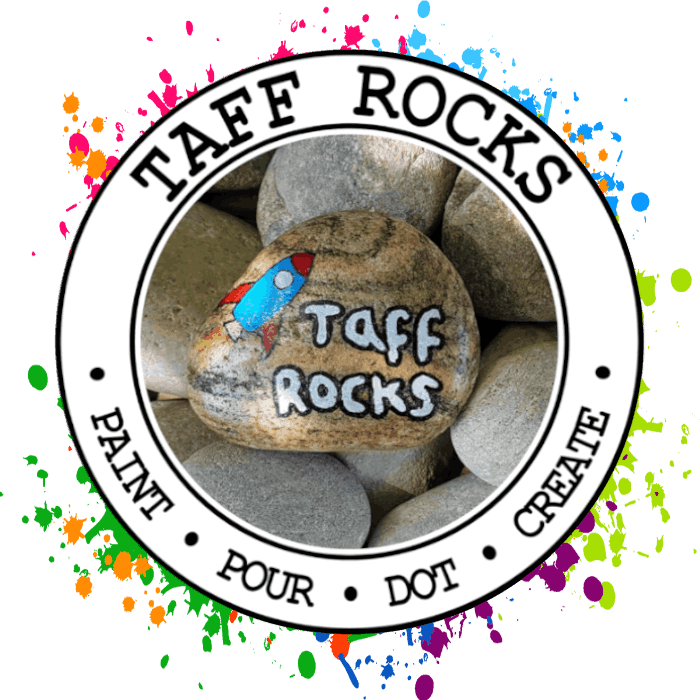 Taff Rocks logo featuring a painted stone with a rocket and the works 'Taff Rocks' surrounded by a smooth river rocks and a circular border reading paint, pour, dot, create